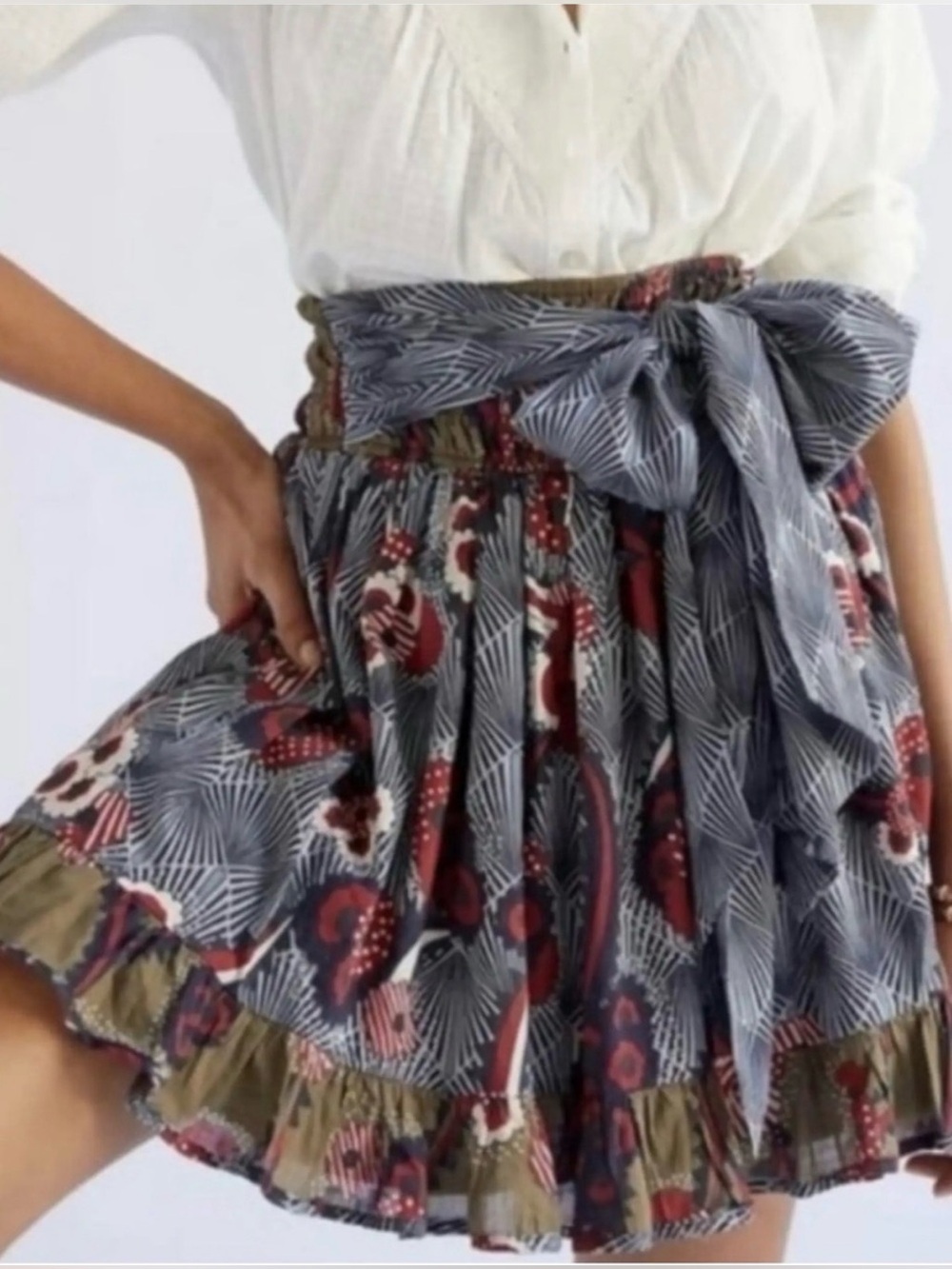 Anthropologie’s Let Me Be  Art Deco Floral Print Belted A-Line Ruffle Mini Skirt